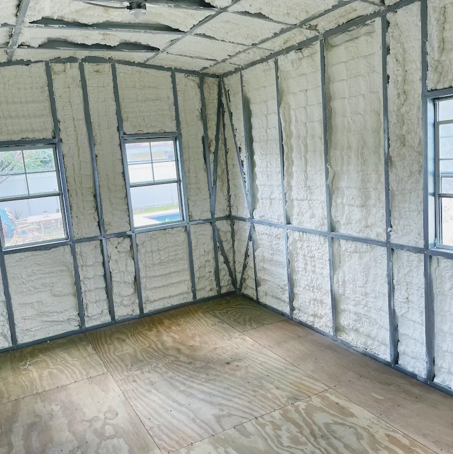 Closed-cell spray foam insulation applied to wall cavities in a residential project in Harpswell